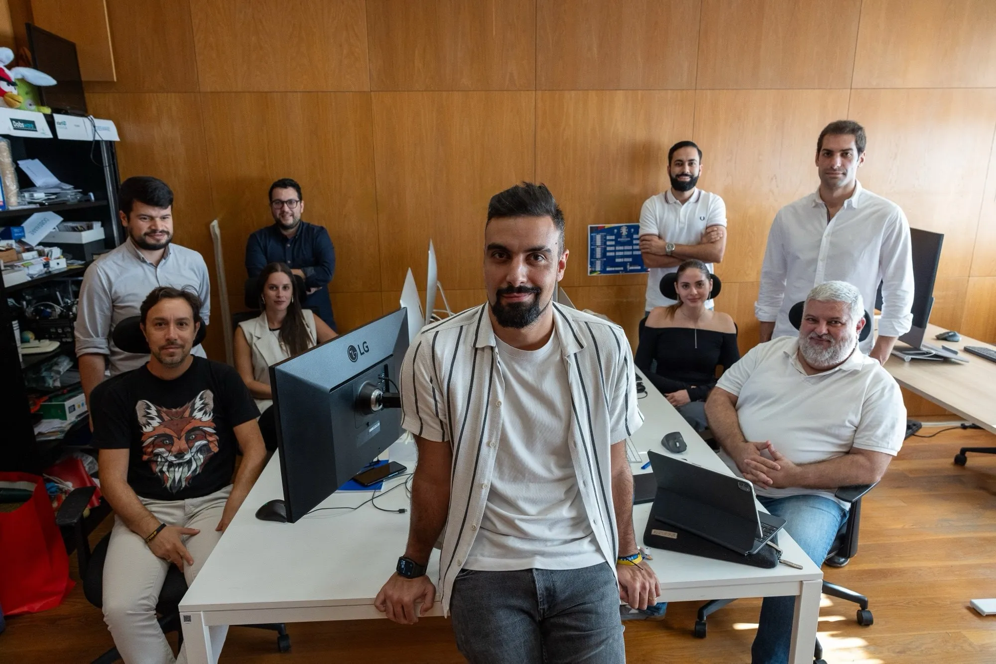The FootAR team in the office, around a desk with screens